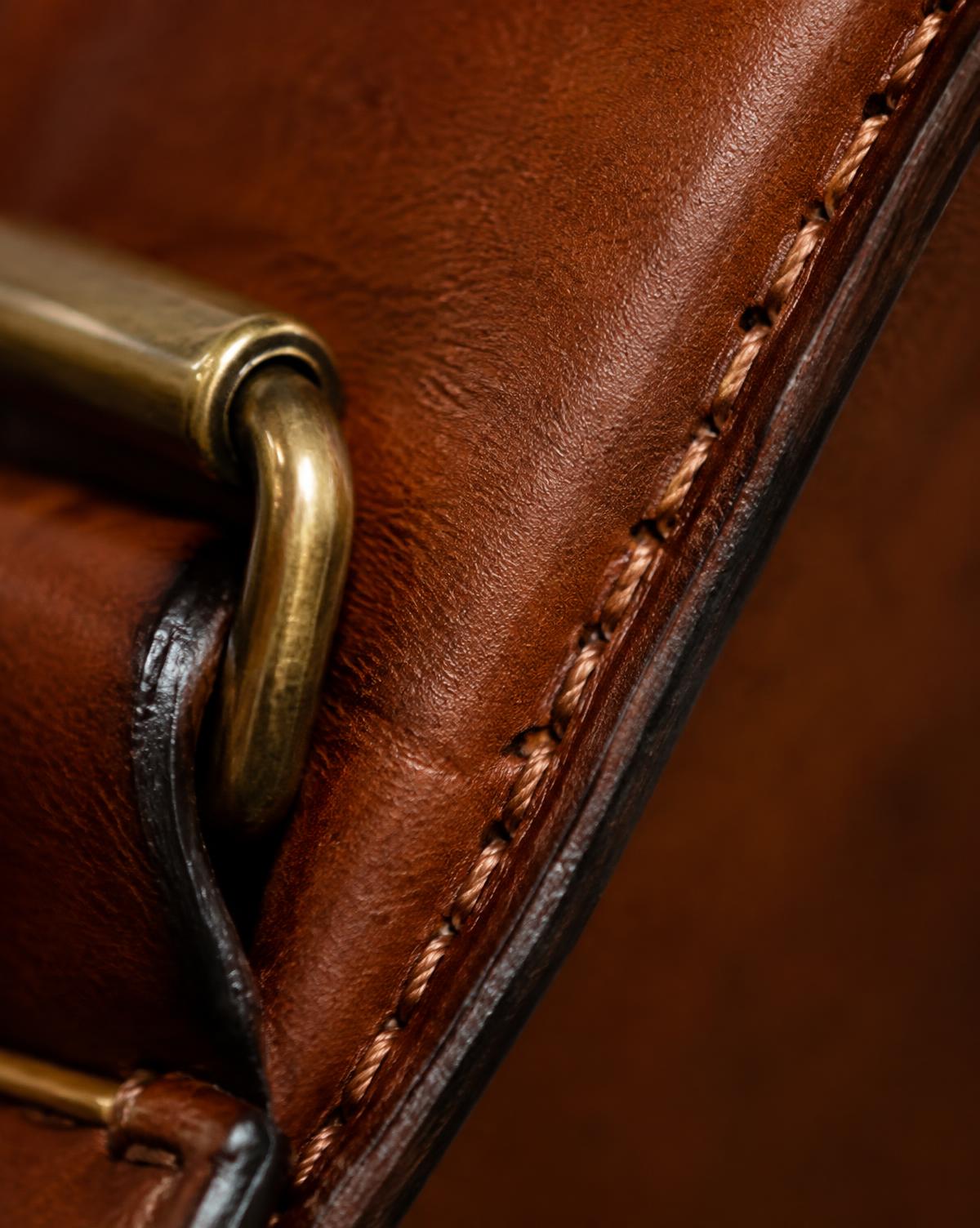 Close-up of leatherwork and brass hardware